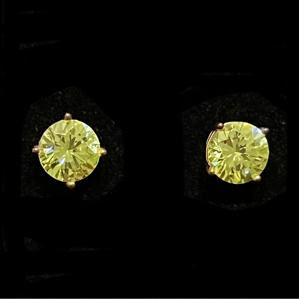 Green Swarovski crystal pierced studs in gold setting. NWOT